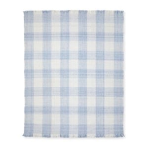 A blue and white indoor outdoor rug on a white background.